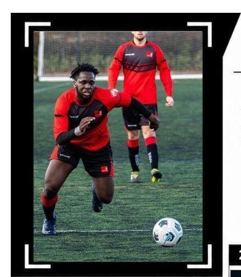 Olabanji Ibidapo attacking with the ball in a red and black football kit